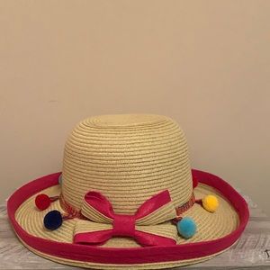 SS pink hat with colorful pom poms